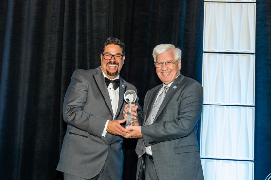 Tim Quigley Receives Surprise Award from Roger-Mark De Souza